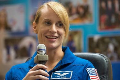 NASA astronaut Kate Rubins seen in quarantine behind glass during a crew press conference at the Cosmonaut Hotel in Baikonur, Kazakhstan, July 6, 2016.