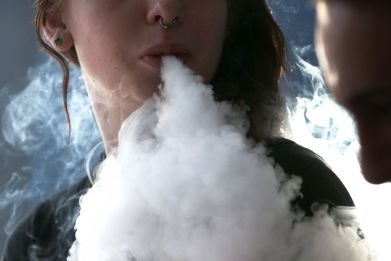A woman smokes an e-cigarette at Digital Ciggz in San Rafael, California, on Jan. 28, 2015
