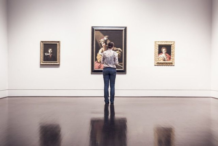 Woman looking at art