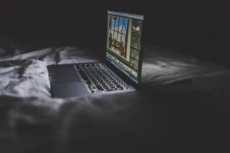 Laptop on bed