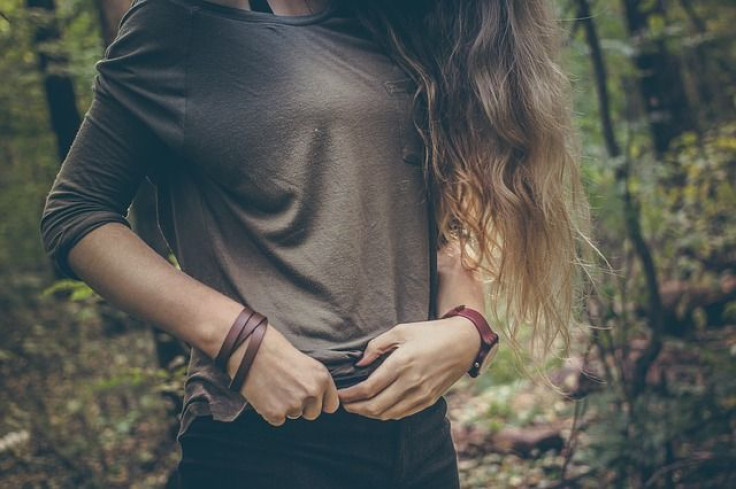 Girl holding side of stomach