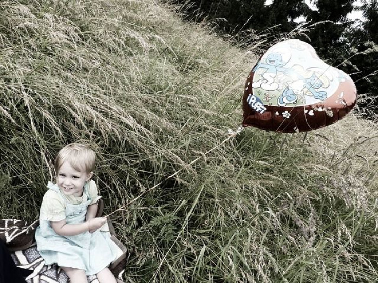 Child with heart balloon