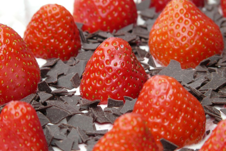 Enjoying strawberries and dark chocolate may help give a boost to your sex life.