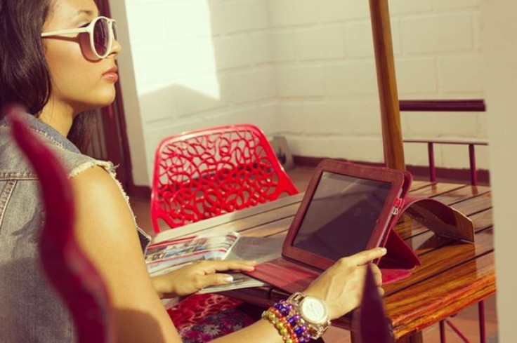 Woman looking away from computer