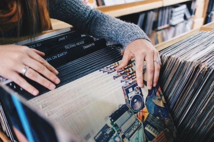 Woman looking at records