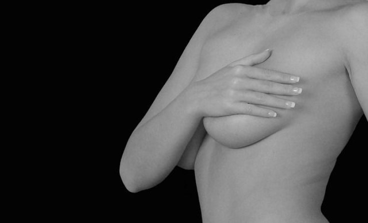 Women holding breasts