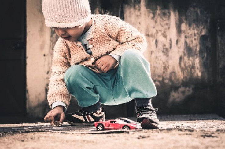 Boy playing on ground