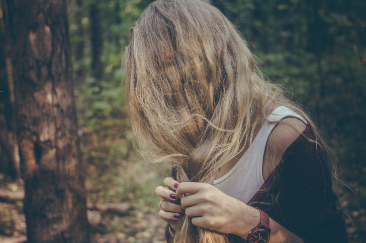 Girl braiding hair