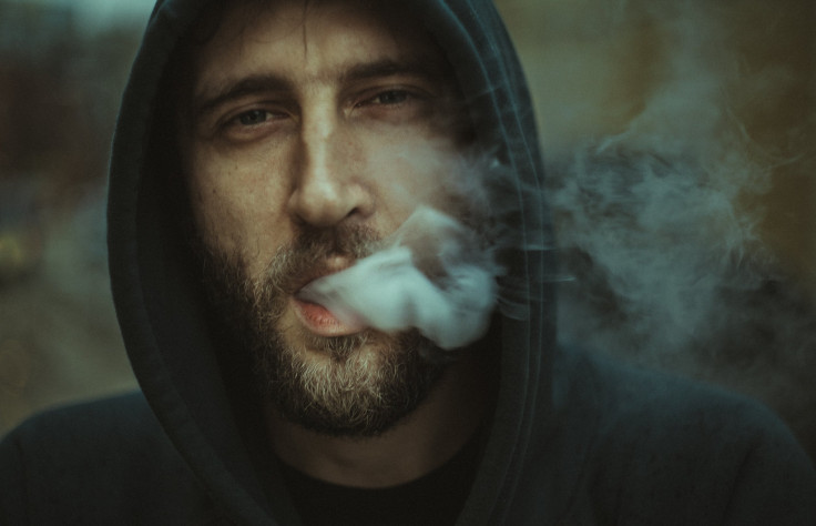 Man blowing smoke