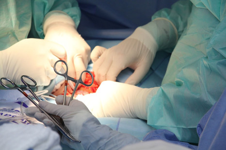 A pair of surgical scissors have been removed after they were left in a man's abdomen for 18 years.