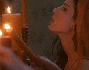 Lighting a candle with your breath is Sandra Bullock's specialty.