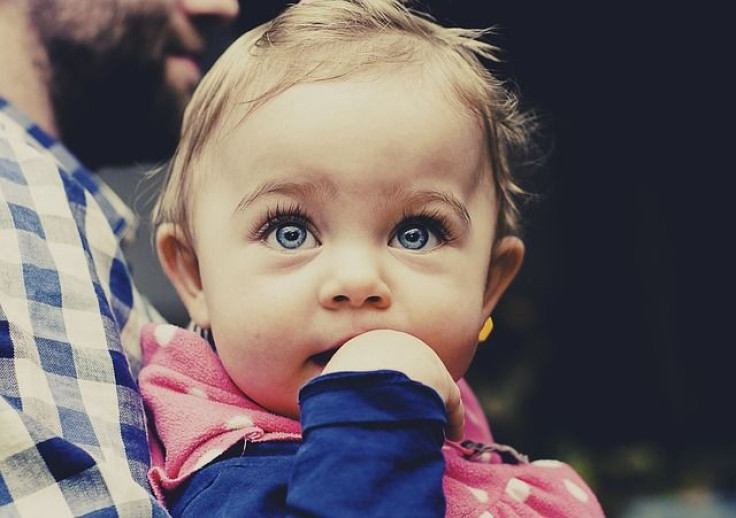 Baby girl looking up