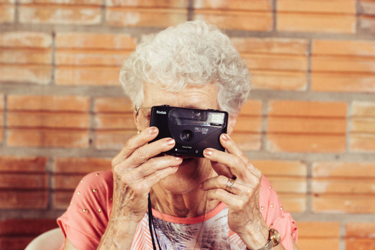 Older woman taking photo
