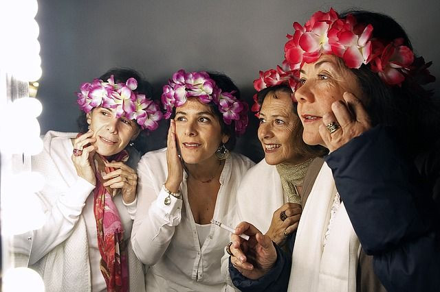 Women looking in mirror