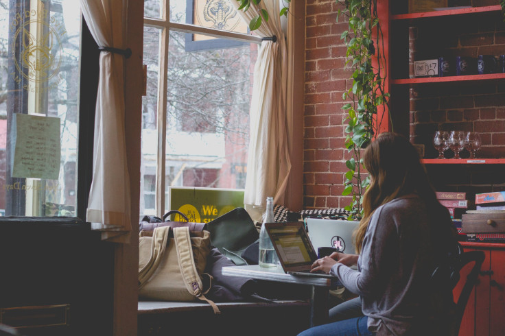 Woman sitting down in cafe