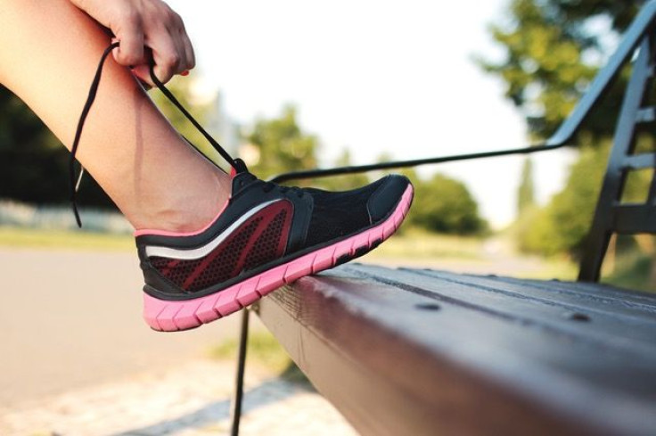 Woman tying sneakers