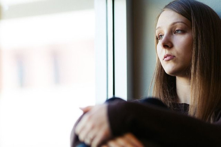 Woman looking out window