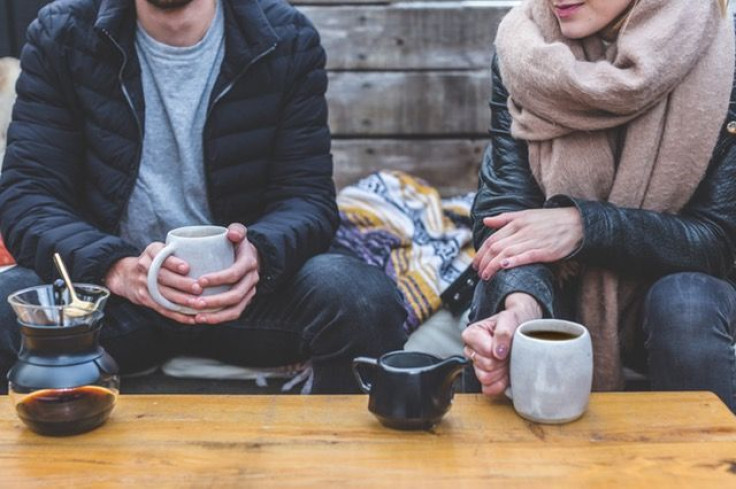 Man and woman drinking coffee