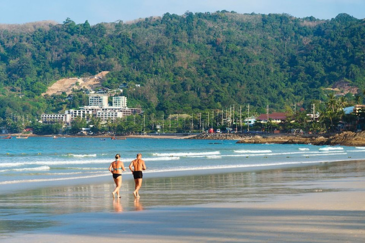 couple running on beach