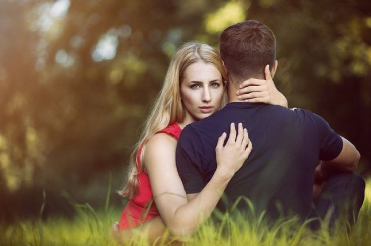 Woman hugging man