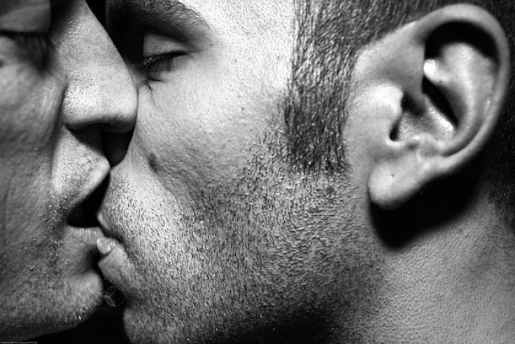 Two men kissing