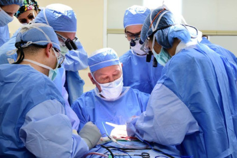 Frank Papay, M.D., (center) directs Cleveland Clinic’s third face transplant.