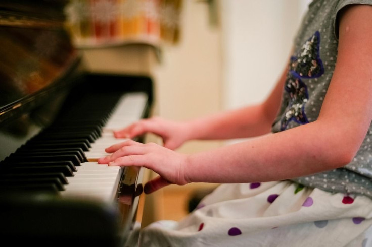 child playing piano