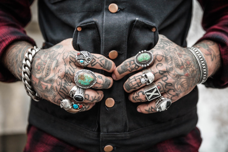 Man with tattoos on hands