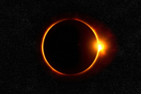 During a solar eclipse, the moon passes between the sun and earth and blocks nearly all or part of the sun.