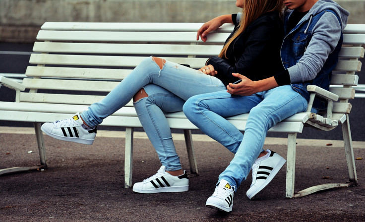 Man and woman sitting on a bench