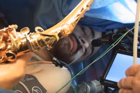 A saxophone player serenades doctors on the operating table as he undergoes brain surgery.