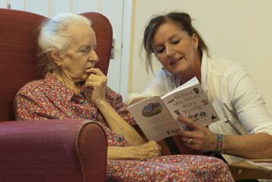 A volunteer from the 'Kissing it Better' charity read poems on October 29 2013, to a resident of a retirement home in Stratford upon Avon who has been diagnosed with dementia. People can avoid early signs of dementia by doing regular physical and mental exercises while young.