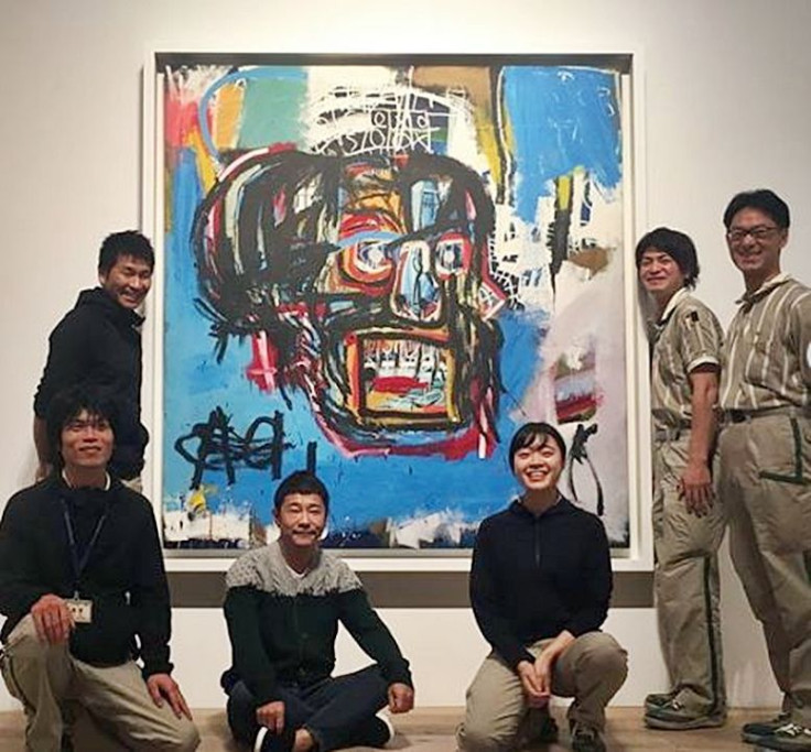 Yusaku Maezawa (3rd from left) and his $110 million painting, Untitled, by Basquiat