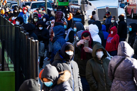 People line up outside Elmhurst Hospital to get tested due to coronavirus outbreak on March 24, 2020 in Queens, New York City.