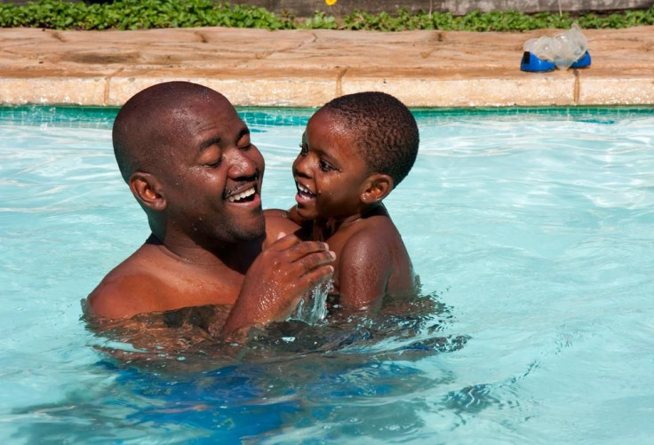 Black child in pool PhotoCourtesyof_a href=_http-__www