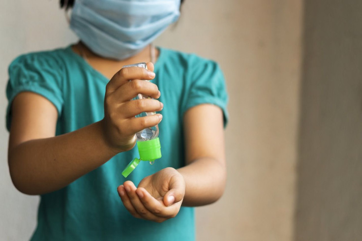 kids-wearing-mask-using-sanitizer