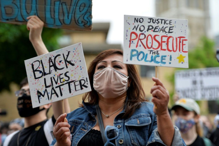 a-demonstrator-holding-a-black-lives-matter-sign