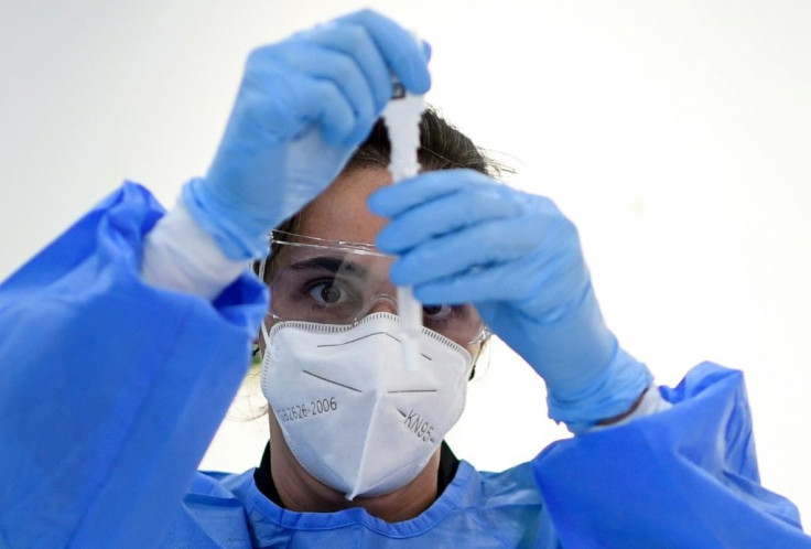 a-medical-worker-runs-a-rapid-covid-19