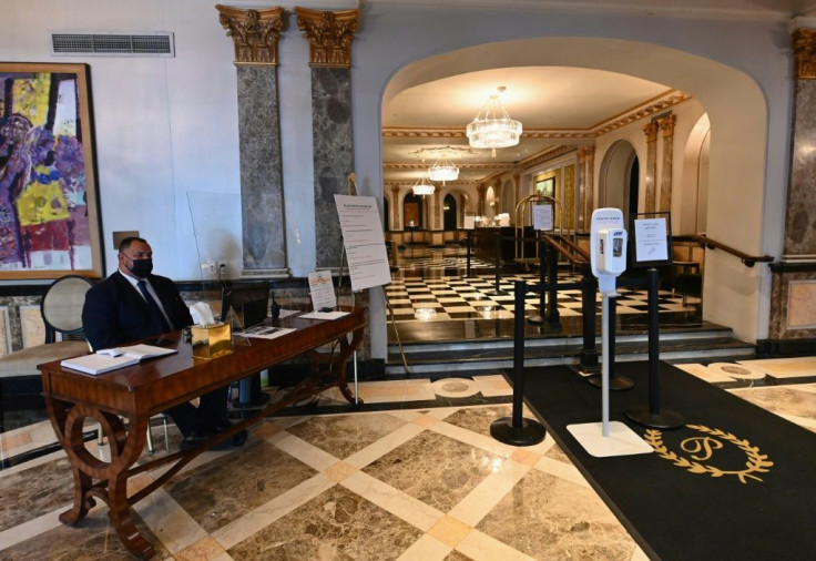 a-security-officer-sits-in-the-lobby-of