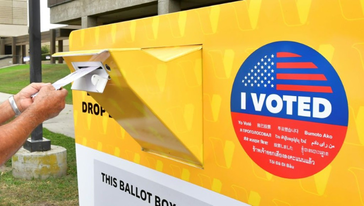 a-voter-drops-a-ballot-for-the-us