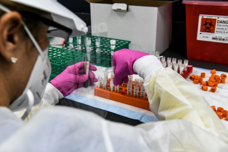 A lab technician sorts blood samples inside a lab for a Covid-19 vaccine study at the Research Centers of America (RCA) in Hollywood, Florida