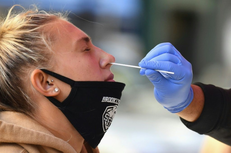 a-medical-worker-takes-a-nasal-swab-sample
