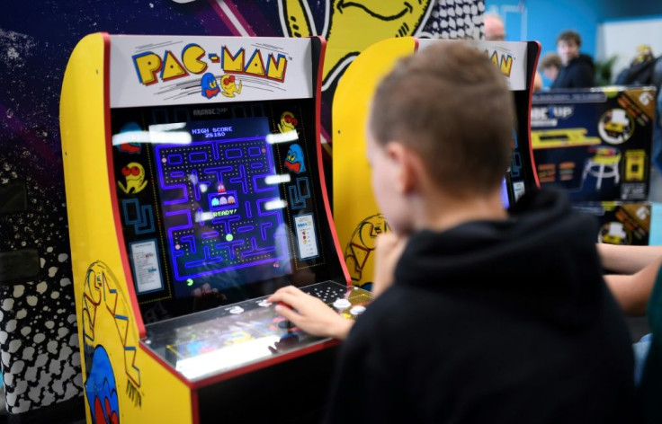 Kid with Video Game Cabinet