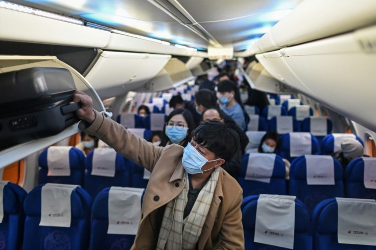Airplane passengers wearing masks