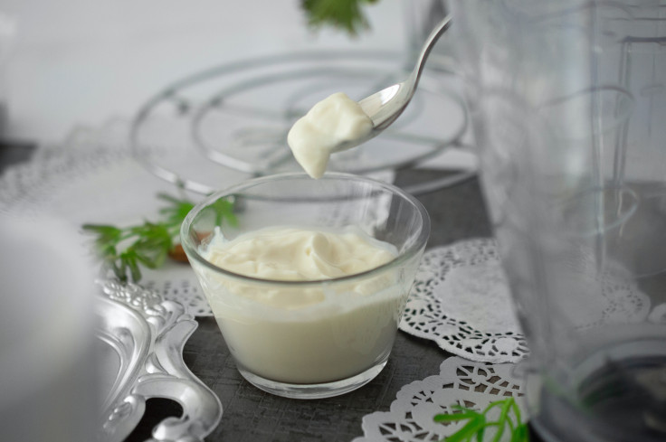 white cream in clear shot glass