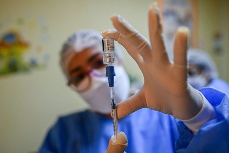 A nurse prepares a dose of the Pfizer-BioNTech vaccine against COVID-19 amid the novel coronavirus pandemic, in Taboga Island, Panama on May 21, 2021