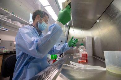 Dr. Jesse Erasmus works on the development of a replicon, or replicating, RNA vaccine, used to combat Covid-19 (SARS-CoV-2), at a microbiology lab at the University of Washington School of Medicine on December 10, 2020 in Seattle, Washington.