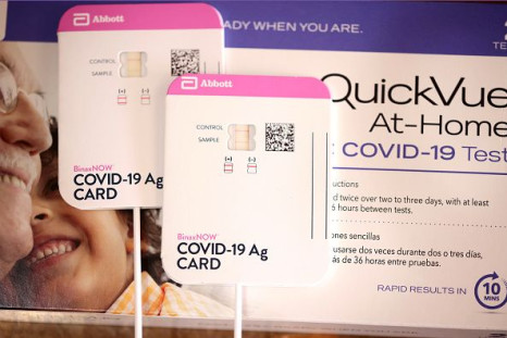 In this photo illustration, At-home COVID-19 tests by Abbott and Quidel are shown on September 14, 2021 in Chicago, Illinois. At-home tests are becoming increasingly difficult to find despite manufacturers boosting production as COVID-19 cases rise in schools and employers increase monitoring.