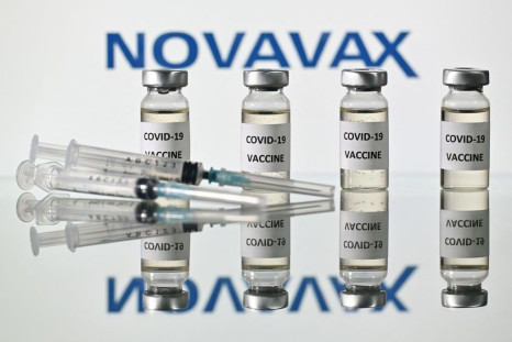 An illustration picture shows vials with Covid-19 Vaccine stickers attached and syringes with the logo of US biotech company Novavax, on November 17, 2020.
