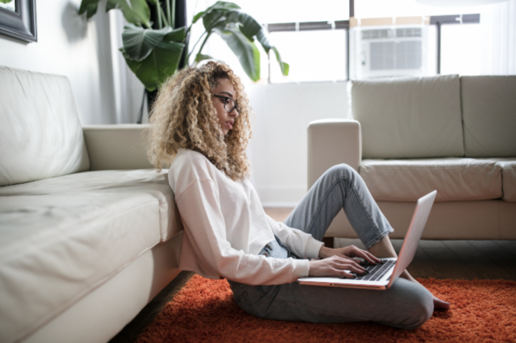 Woman Typing on Laptop